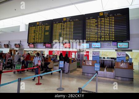 check in desks with departures board in terminal t1 arricife cesr manrique-Lanzarote airport canary islands spain Stock Photo