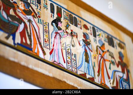 Egyptian painting on old parchment paper. Stock Photo