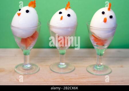 three boiled egg in the shape of a chick. funny food. easter food. Stock Photo