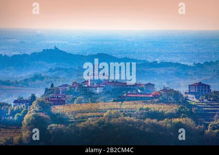 Look from the street in  Brda, Slovenia in direction of well known village of Smartno and surroundings in late afternoon with radiant light Stock Photo