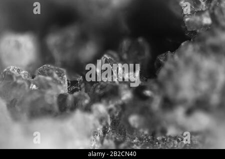 Black and white photograph of the structure of the surface of crystals. Close-up. Blurred background Stock Photo