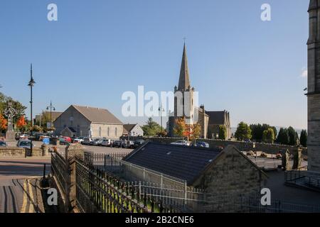 Autumn in Letterkenny, view across the grounds of St Eunan's Cathedral to Conwal Parish Church with ashlar spire (r) and Trinity Hall (l) Stock Photo