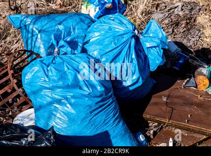 Many blue garbage bags on the recycling center Stock Photo