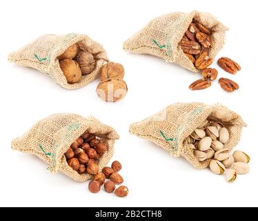 Collection of hazelnuts, pecan, walnuts and pistachios in sacks isolated on white background Stock Photo