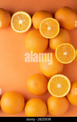 Fresh slice oranges on paper. Top view and copy space. Flat lay orange background cut and full orange Stock Photo
