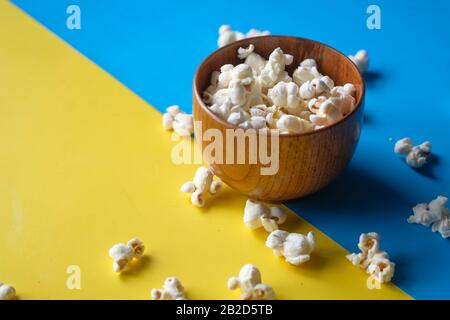 Close up of popcorn in a bowl on color background  Stock Photo