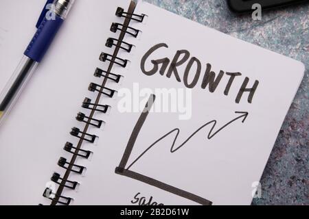 growth chart on notepad with pen on table  Stock Photo