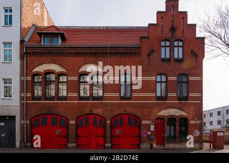 Volunteer fire brigade, an old fire station in Berlin, Oberschoeneweide, Germany, red gates Stock Photo
