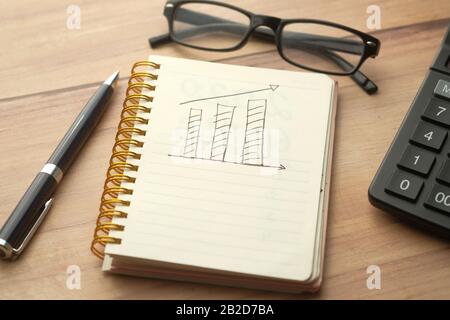 growth chart on notepad with pen on table  Stock Photo