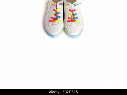 Close up running shoes with rainbow laces for the child on a isolated backgroun. Top view. Stock Photo