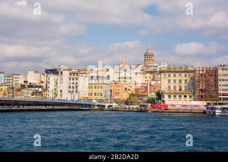 Istanbul, Turkey - September 19th 2019. The Galata Bridge and Galata Tower in the Beyoglu side of Istanbul viewed from the Fatih shore.