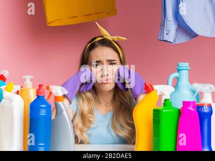 Housewife is sad she has a lot of housekeeping Stock Photo