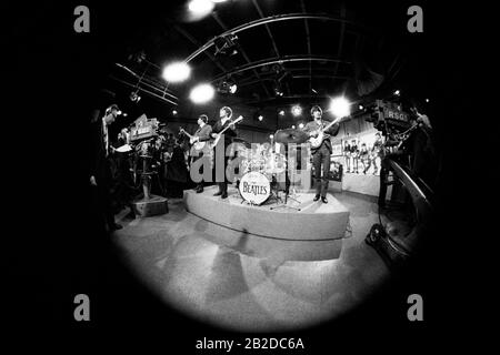 LONDON, UNITED KINGDOM - MARCH 20: (Fisheye) English singer-songwriter and multi-instrumentalist Paul McCartney, English singer, songwriter and guitarist John Lennon (1940-1980), English musician, singer and drummer Ringo Starr and English musician, singer-songwriter and guitarist George Harrison (1943-2001) perform on stage during their second appearance on Ready Steady Go! on March 20, 1964 in London, United Kingdom.Credit: Icon and Image /  MediaPunch Stock Photo