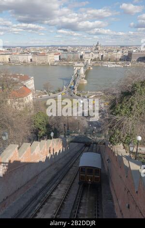 Budapest, Hungary. 2nd Mar, 2020. The Buda Castle Hill Funicular is seen with the view of the city in Budapest, Hungary, on March 2, 2020. The Buda Castle Hill Funicular, a tourist attraction of Budapest, turned 150 years old on Monday. Credit: Attila Volgyi/Xinhua/Alamy Live News Stock Photo