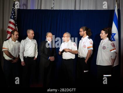 Former NYC Mayor and 2020 Democratic presidential candidate Michael Bloomberg meets with Israeli Megen David Adom paramedics Dedi Otek, Ido Rosenblatt, Michael Bloomberg, Yonotan Yagovdosky, Yuval Eran, and Elana Abrams backstage after speaking to 18,000 delegates to the AIPAC Policy Conference in Washington, DC March 2, 2020. Bloomberg Philanthropies is a major donor to MDA including their flagship emergency medical station in Jerusalem, one of 169, this one named for Bloomberg’s father. MDA is Israel’s national emergency medical and blood services organization.   Credit: Marty van Duyne  Pho Stock Photo