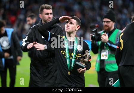 Manchester City's Phil Foden with his man of the match trophy after his side win the Carabao Cup Final Stock Photo