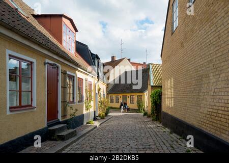 University town Lund, southern Sweden. Colorful houses in cobblestone street in the city center. Stock Photo