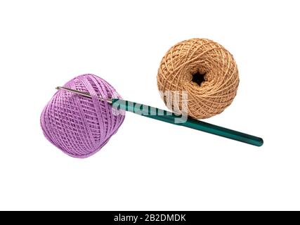 Ball of wool yarn and crochet hook isolated on white background. Stock Photo