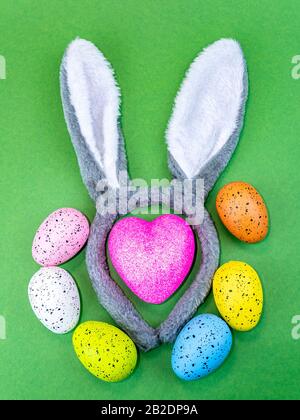 Colored easter eggs with bunny ears and heart. Stock Photo