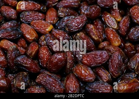 Fresh Medjool Dates background. Healthy organic product. Top view. Close up. Stock Photo