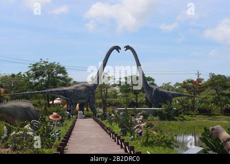 Sanya Hainan - 26 june 2019,  Paddy Field National Park Museum with historical sculptures of dinosaurs in the open air in Whale on Hainan Island О Stock Photo