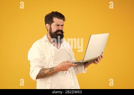 Digital world. Successful developer. Online shopping. Programmer with laptop Surfing internet. Online payment. Online purchase. Man using notebook. Programming concept Bearded man with notebook. Stock Photo