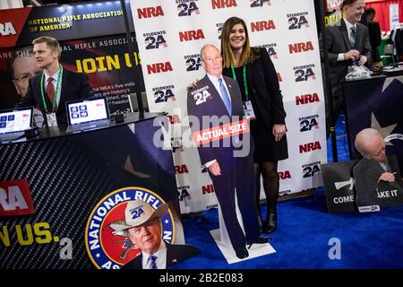 Oxon Hill, Md. 27th Feb, 2020. OXON HILL, Md. - FEBRUARY 27: Erin Demma stands with a cut out of Democratic Presidential hopeful former New York City Mayor Michael Bloomberg at the Conservative Political Action Conference, CPAC 2020, in Oxon Hill, Md., on Thursday, February 27, 2020.Credit: Samuel Corum/CNP (RESTRICTION: NO New York or New Jersey Newspapers or newspapers within a 75 mile radius of New York City) | usage worldwide Credit: dpa/Alamy Live News Stock Photo