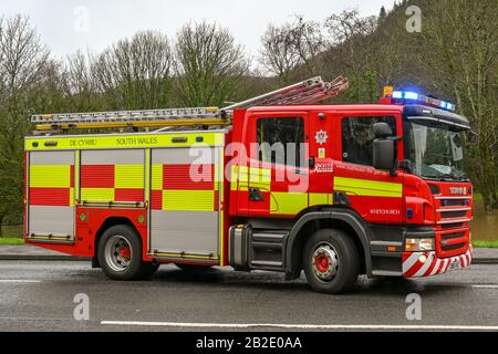 NANTGARW, NEAR CARDIFF, WALES - FEBRUARY 2020: South Wales Fire and rescue service fire tender with blue lights flashing at an incident near Cardiff Stock Photo