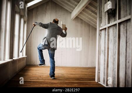 Middle-aged man dancing with a cane Stock Photo