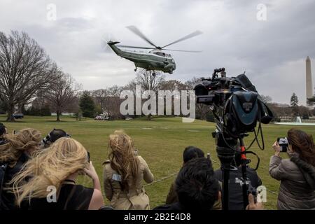 Washington, United States. 02nd Mar, 2020. Guests and media watch President Donald Trump take of in marine on the south lawn of the White House in Washington, DC on Monday, March 2, 2020. President Donald Trump heads to North Carolina for Make America Great Rally. Photo by Tasos Katopodis/UPI Credit: UPI/Alamy Live News Stock Photo
