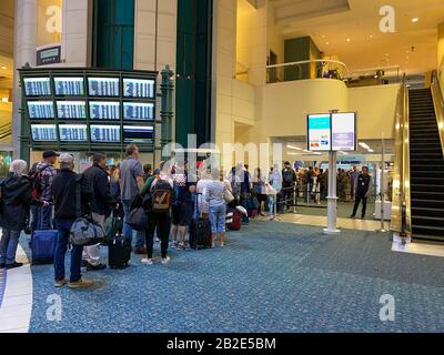 Orlando,FL/USA-2/27/20:  People waiting in line to go through Orlando International Airport MCO TSA security on a busy day. Stock Photo