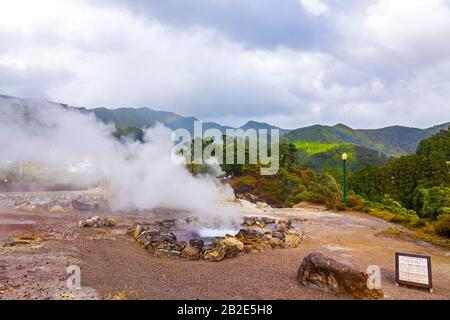 Hot thermal springs in Furnas village, Sao Miguel island, Azores, Portugal. Caldeira Grande (translates from Portuguese as Big Boiler) Stock Photo