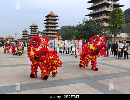 KAOHSIUNG, TAIWAN -- JANUARY 25, 2020: Traditional Chinese Lion dancers perform at the Fo Guang Shan Buddhist complex during Chinese New Year. Stock Photo