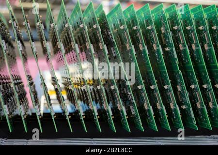 Printed Circuit Boards (PCB) stacked in vertical rack Stock Photo