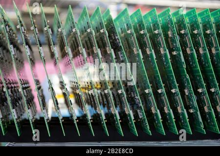 Printed Circuit Boards (PCB) stacked in vertical rack Stock Photo