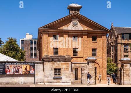 Sydney, Australia - December 11, 2009: Brown brick stone Hyde Park Barracks museum building under blue sky. Main entrance shows Macquarie Governor nam Stock Photo