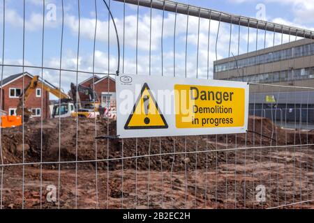 Warning sign for demolition in progress, housing development on Wavertree Road and Marmaduke street, Liverpool Stock Photo