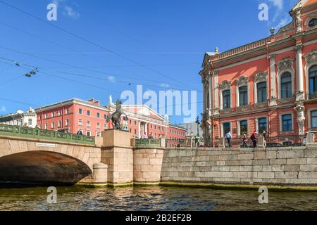 View from a canal of electrical and telephone wires crossing above the Anichkov Bridge and Horse Tamer sculpture in Saint Petersburg, Russia. Stock Photo