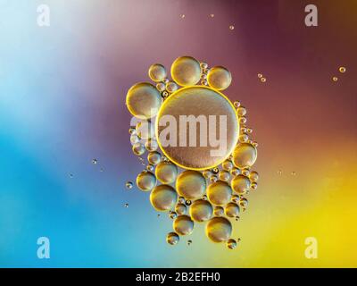 oil bubbles on water with colorful background Stock Photo