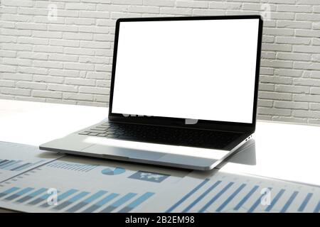 man Using laptop with blank screen work on Blank screen computer Cloud computing Stock Photo
