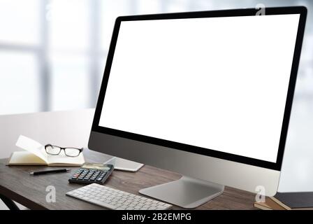 Laptop computer in mockup blank screen on laptop computer on wooden desk Laptop with blank screen on table. Stock Photo
