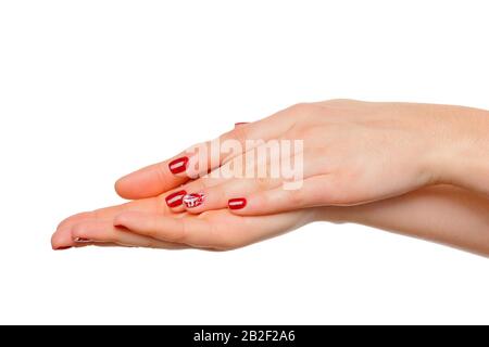 Close-up of beautiful woman's hands, palms up. Isolated on white background Stock Photo