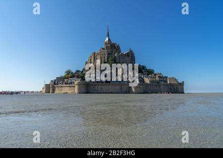 Mont Saint Michel across the sand from the bay at low tide, Normandy, France Stock Photo