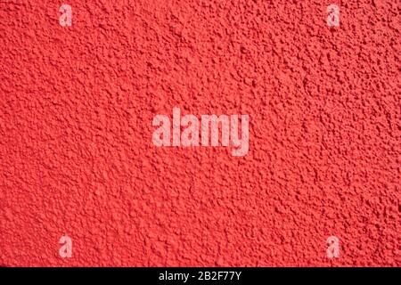 Textured grunge red wall background of a building Stock Photo