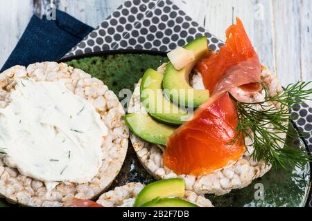 salted salmon fillet with crispbread and avocado. Aromatic herbs, spices and vegetables - healthy food, diet concept. cherry tomato. superfood, open s Stock Photo