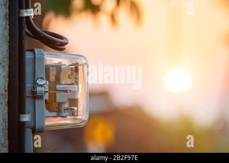 Thailand's electric meter. Electric meter installed on the pole to measurement watt in the house Stock Photo