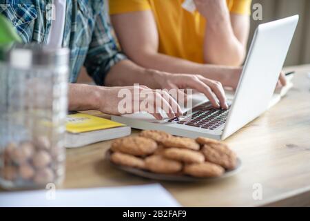Close up pictures of mans hands typing Stock Photo