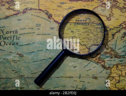 Magnifying glass on USA map Stock Photo