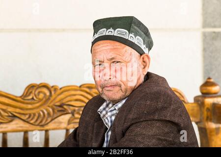 Local man at restaurant, M39 road, Qashqadaryo Region, Uzbekistan, Central Asia, Asia Stock Photo