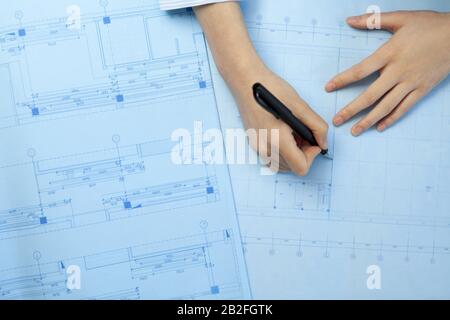 Architect drawing blueprints Beijing China Stock Photo